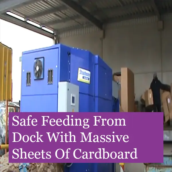 Dock-fed-baler-with-offramp Massive hopper baler with offramp and fed from a dock