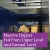 Massive-Hopper-Fed-From-Upper-And-Ground-Levels The Baletainer can be easily fed by chute, ground or upper levels