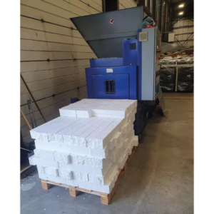 A large palette of polystyrene next to the StyroPress.